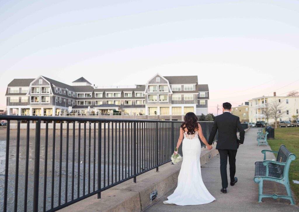 couple portraits beauport hotel in background